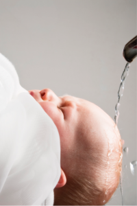 man in white dress shirt carrying baby in white dress